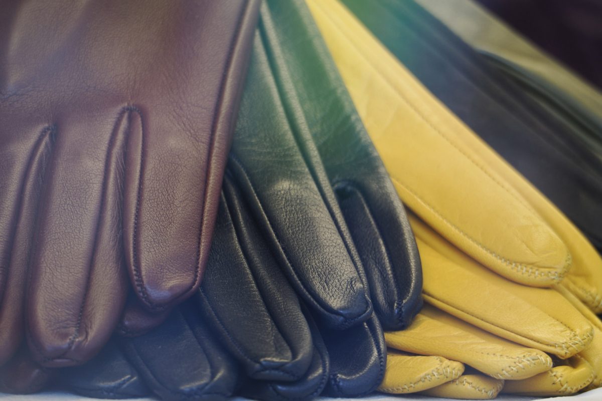 many different colors leather gloves on display